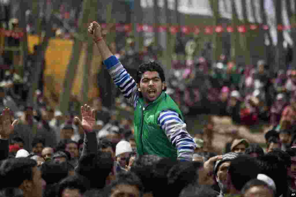 A Kashmiri activist of the National Conference party shouts slogans at an election rally on the outskirts of Srinagar, India, Tuesday, April 8, 2014. Voters in India's remote northeast cast ballots on the first day of the world's biggest election Monday, 