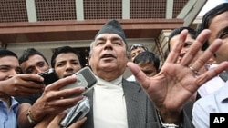 Nepali Congress party vice-chairman Ram Chandra Poudel talks to the media after casting his vote for the prime minister's post in Kathmandu, Nepal, 7 Oct 2010