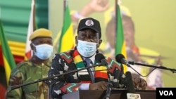 FILE: Zimbabwe President Emmerson Mnangagwa speaks at an annual conference of the ruling ZANU-PF party in Bindura, 80 kilometers north of Zimbabwe’s capital Harare, Oct. 30, 2021. (Columbus Mavhunga/VOA)