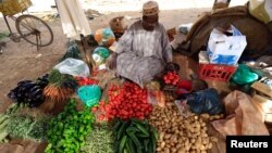 A street vendor waits for customers in Khartoum, Sudan, Dec. 2, 2016. If African countries want to be able to feed a quickly increasing population, leaders need to start planning now, according to a report in the Proceedings of the National Academy of Sciences.