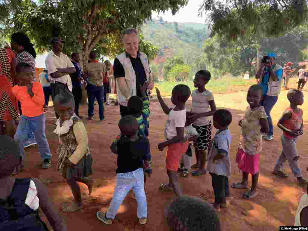 Kids play with Bo Viktor Nylund, the deputy regional director for UNICEF, March 26, 2019, at Ngangu School in Chimanimani district, which has been turned into a rehabilitation center to deal with children traumatized by Cyclone Idai.