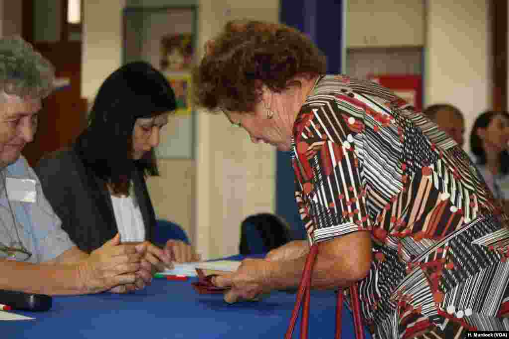 Early voters trickle into polling places in Morahalm, Hungary, near the border with Serbia, Oct. 2, 2016.