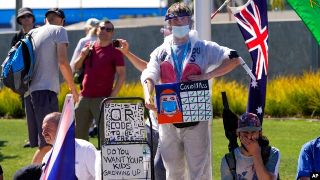 Anti-vaccination protesters demonstrate outside Melbourne Park after Serbia's Novak Djokovic was believed to be held at an immigration detention hotel in Melbourne, Australia, Jan. 15, 2022.