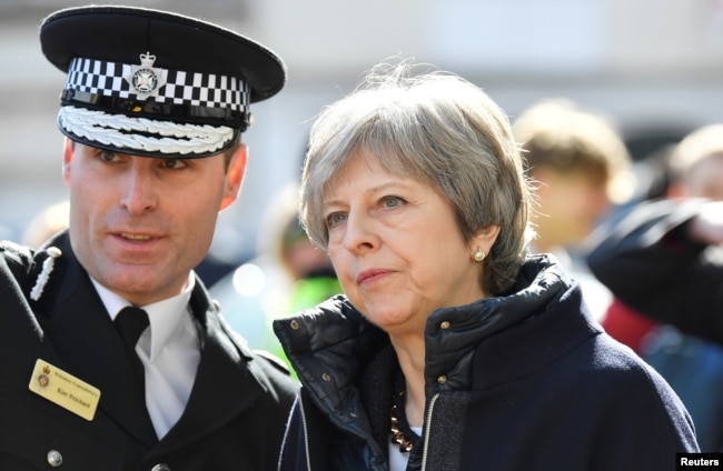 Britain's Prime Minister Theresa May visits Salisbury on March 15, 2018, the British city where a former Russian intelligence officer Sergei Skripal and his daughter Yulia were poisoned two weeks earlier.