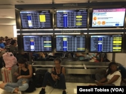 Stranded travelers at the Fort Lauderdale, Florida, airport look for ways to get out of the state in anticipation of Hurricane Irma’s arrival, expected to hit the area this weekend, Sept. 7, 2017.