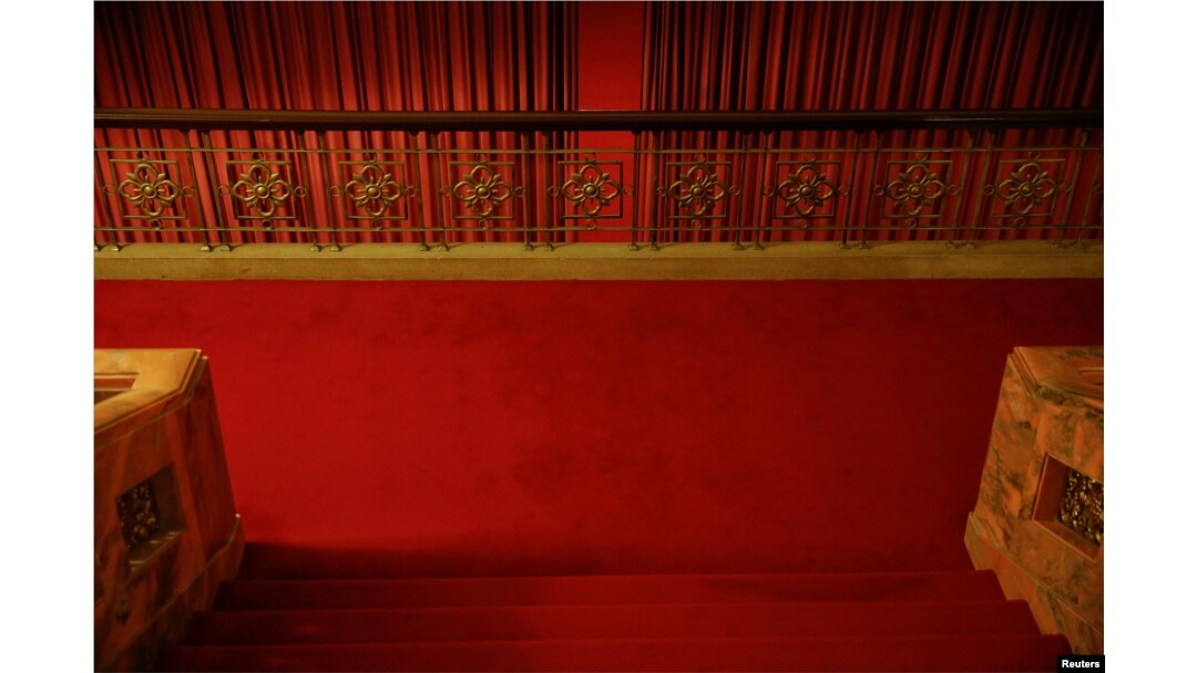 FILE - Red curtains divide interior of the Great Hall of the People where sessions of the National People's Congress and the Chinese People's Political Consultative Conference are held, in Beijing, China, March 6, 2016.