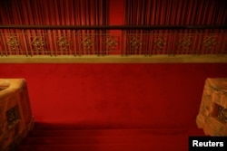 FILE - Red curtains divide interior of the Great Hall of the People where sessions of the National People's Congress and the Chinese People's Political Consultative Conference are held, in Beijing, China, March 6, 2016.