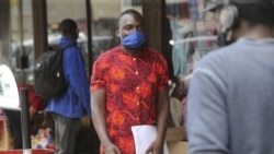 Emmanuel Reyai walks on the streets of Harare while looking for a job, Wednesday, Aug, 5, 2020.