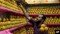 An Indian vendor displays Alphonso mangoes at a whole sale market in Mumbai, India, May 6, 2014.