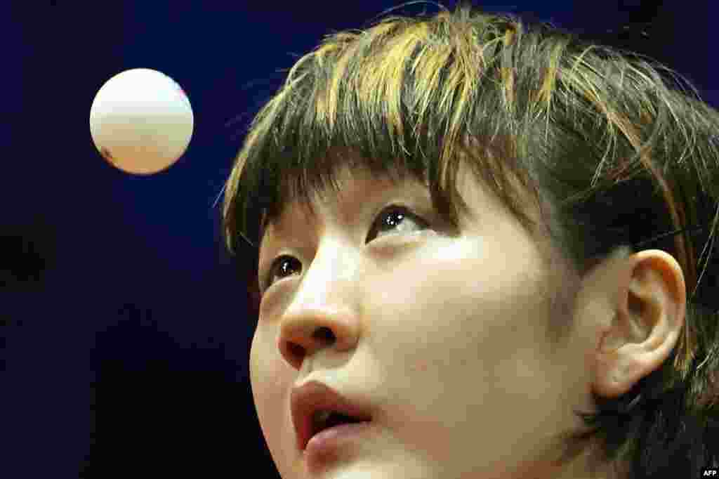 China&#39;s Chen Meng eyes the ball as she plays against Singapore&#39;s Xin Ru Wong during their women&#39;s single match at the Liebherr 2019 ITTF World Table Tennis Championships in Budapest, Hungary.