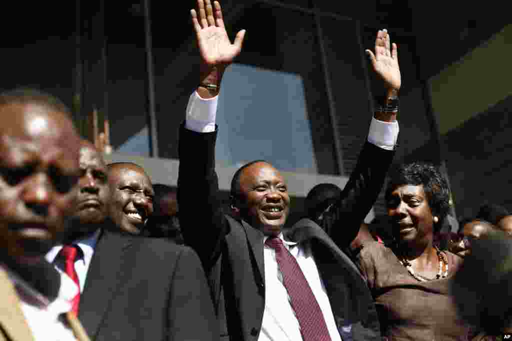 Kenyan president-elect Uhuru Kenyatta waves at supporters after winning the elections in Nairobi, Mar. 9, 2013. 