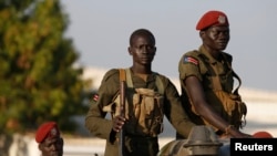 SPLA soldiers stand in a vehicle in Juba days after clashes erupted in December. Fresh fighting at the headquarters of SPLA ground forces triggered panic among Juba residents Wednesday.