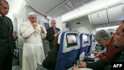 Pope Francis speaks to journalists aboard the flight from Mexico to Italy, Feb. 18, 2016. 