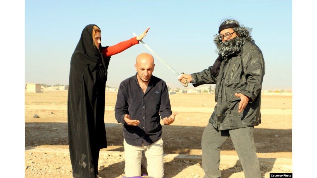 The Arta FM staff performs a mock IS-style execution. (Courtesy - Arta FM)