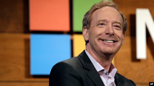FILE - Microsoft's Brad Smith, president and chief legal officer, speaks at the annual Microsoft shareholders meeting in Bellevue, Wash., Nov. 30, 2016.