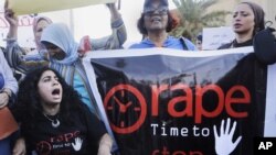 Egyptian women shout slogans and hold banners during a protest against sexual harassment in Cairo, Egypt, Saturday, June 14, 2014.