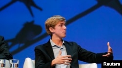 FILE -Chris Hughes, co-founder of Facebook, speaks at a conference in Boston, Massachusetts.