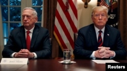 FILE - President Trump gets a briefing from his senior military leaders, including Defense Secretary James Mattis (L), in the Cabinet Room at the White House, October 23, 2018.