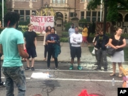 About 200 people gathered outside the Minnesota Governor's Residence in St. Paul on July 7, 2016 protesting the fatal shooting of a man by a suburban police officer.