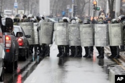 FILE - Belarus police block a street during an opposition rally in Minsk, March 25, 2017.
