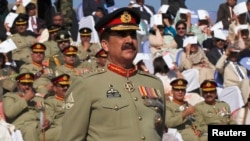 FILE - Pakistan's newly appointed army chief General Raheel Sharif attends the change of command ceremony in with outgoing army chief General Ashfaq Kayani (not in picture) at army headquarters in Rawalpindi, Nov. 29, 2013.