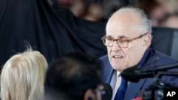 FILE - Former New York City mayor Rudy Giuliani speaks to mourners ahead of a funeral service at the Billy Graham Library for Rev. Billy Graham, March 2, 2018, in Charlotte, North Carolina. 