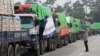 FILE - South Korean trucks with food aid prepare to leave for the North Korean city of Kaesong in Paju, South Korea, Sept. 21, 2012. 