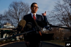 Treasury Secretary Steve Mnuchin speaks with reporters outside the White House, Feb. 6, 2019.