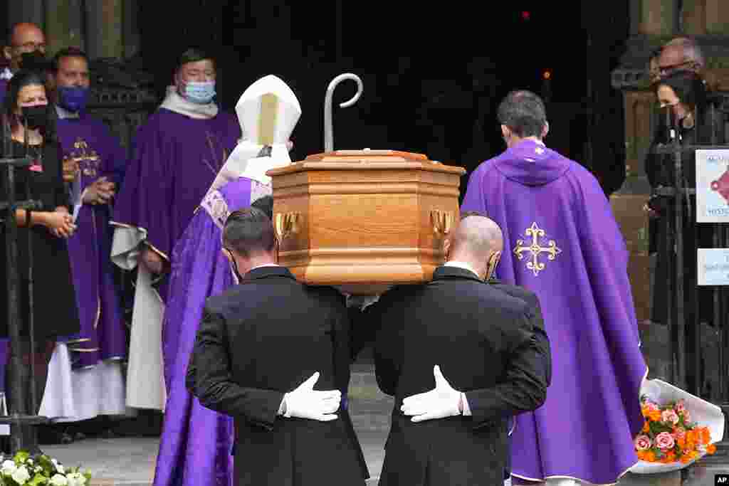 Pallbearers carry the coffin of actor Jean-Paul Belmondo at the Saint Germain des Pr&#232;s church, in Paris. The star of the iconic French New Wave film &quot;Breathless&quot; died Monday at age 88. 