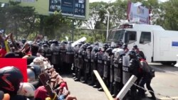 Demonstrators clash with police in Mynamar's capital Naypyitaw, Feb. 9, 2021.