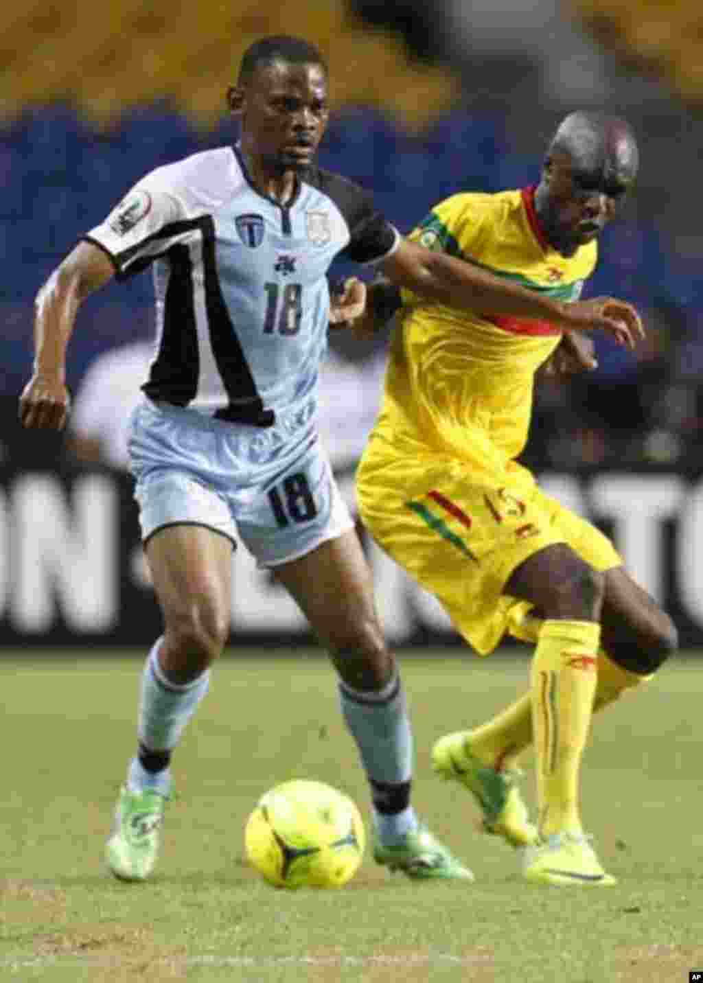 Botswana's Mogogi Gabonamong (18) plays against Mali's Bakaye Traore (15) during their final African Cup of Nations Group D soccer match at the Stade De L'Amitie Stadium in Libreville February 1, 2012.
