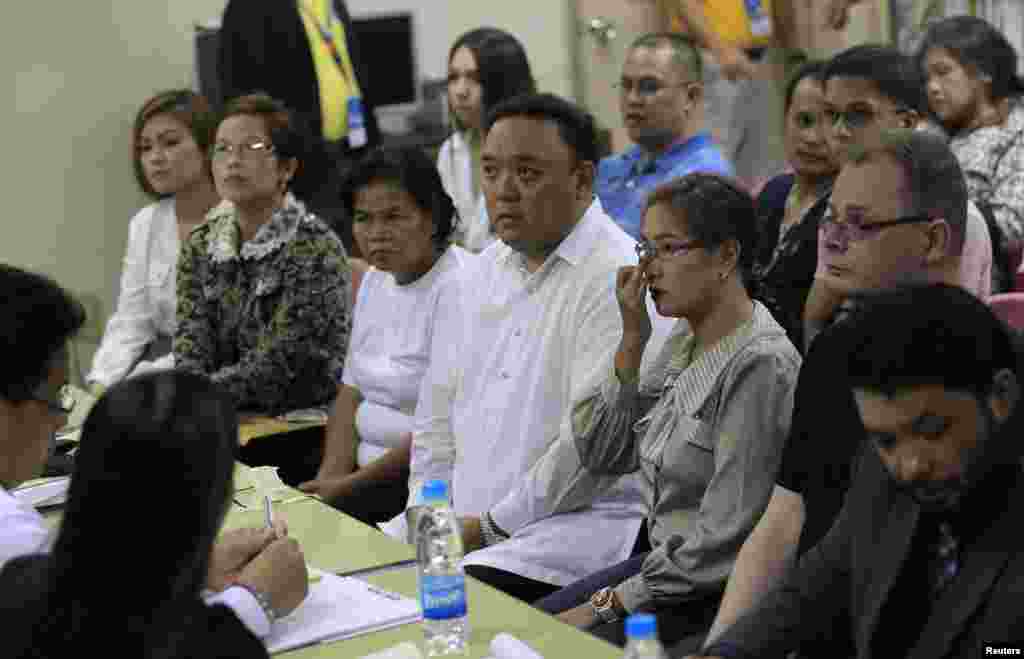 Family members of slain transgender Jennifer Laude attend the preliminary investigations into Jennifer&#39;s death with her lawyers at the Justice Hall in Olongapo City, north of Manila, Oct. 21, 2014. 