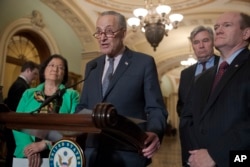 Senate Minority Leader Chuck Schumer, D-N.Y., joined (L-R) by Sen. Mazie Hirono, D-Hawaii, Sen. Sheldon Whitehouse, D-R.I., and Sen. Chris Coons, D-Del., insists that President Donald Trump has made it clear he's considering firing Special Counsel Robert Mueller and wants to pass legislation to protect Mueller to avoid a constitutional crisis, April 10, 2018.