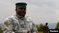 Congolese M23 rebel leader Bisimwa Bertrand speaks to the media in Bunagana, Aug. 2, 2013. 