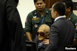 Former Khmer Rouge leader ''Brother Number Two'' Nuon Chea sits inside the courtroom of the Extraordinary Chambers in the Courts of Cambodia (ECCC) as he waits for a verdict, on the outskirts of Phnom Penh, Cambodia, Nov. 16, 2018.