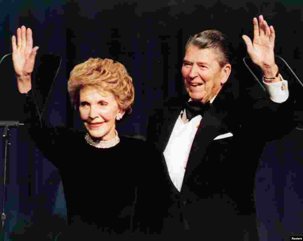 Ronald Reagan and his wife Nancy wave while attending a gala celebrating his 83rd birthday in Washington, Feb. 3, 1994.