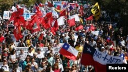 FILE - Demonstrators take part in a protest against national pension system in Valparaiso, Chile, March 26, 2017. 