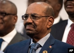 FILE - Sudanese President Omar al-Bashir is seen during the opening session of the AU summit in Johannesburg, June 14, 2015.