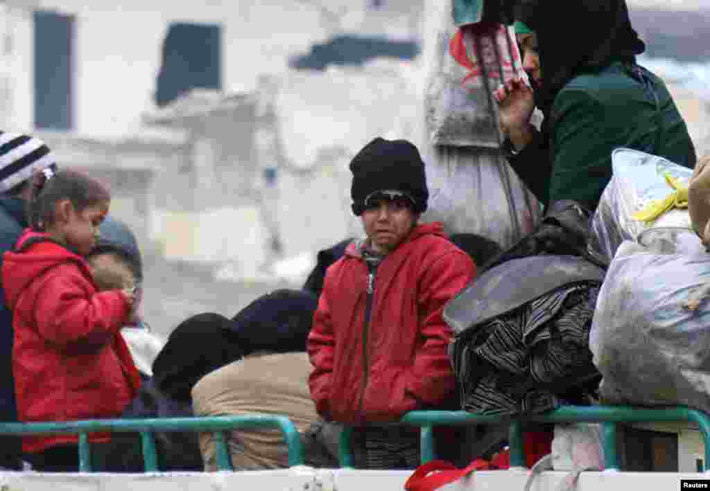  A child waits with others to be evacuated from a rebel-held sector of eastern Aleppo, Syria, Dec. 16, 2016.