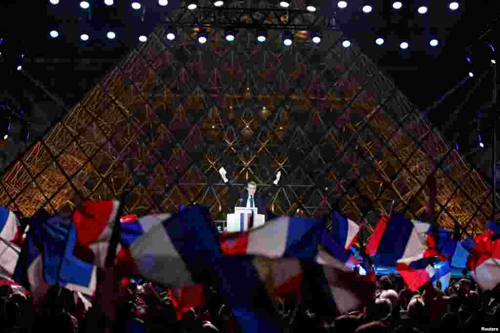 French President-elect Emmanuel Macron celebrates on the stage at his victory rally near the Louvre in Paris, May 7, 2017.