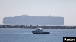 The container ship MSC Danit is seen the day after U.S. Coast Guard and National Transportation Safety Board (NTSB) marine casualty investigators boarded the container ship, off the Port of Long Beach, California, Oct. 17, 2021.