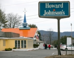 FILE - In this April 8, 2015, file photo, customers walk into Howard Johnson's Restaurant in Lake George, N.Y. The site of the last Howard Johnson's restaurant in the United States. (AP Photo/Mike Groll, File)