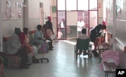 Patients, some of whom are disabled, wait to see doctors in a corridor at Zithulele Hospital. It’s one of the few public health facilities in South Africa that employs physiotherapists