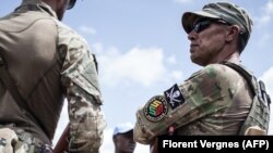 A member of the close protection unit for Central African republic President Touadera, composed of Russian private security company operatives, August 7, 2018. (Florent Vergnes/AFP)