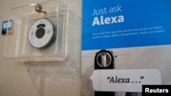 FILE - Prompts on how to use Amazon's Alexa personal assistant are seen in an Amazon "experience center" in Vallejo, California, May 8, 2018. 