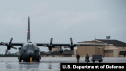 Servicemen from the California National Guard and the Oregon Air National Guard load onto a Texas Air National Guard C-130H Hercules at Hurlburt Field, Florida, Sept. 11, 2017. Supplies, equipment and personnel were transported to the Florida Keys to help