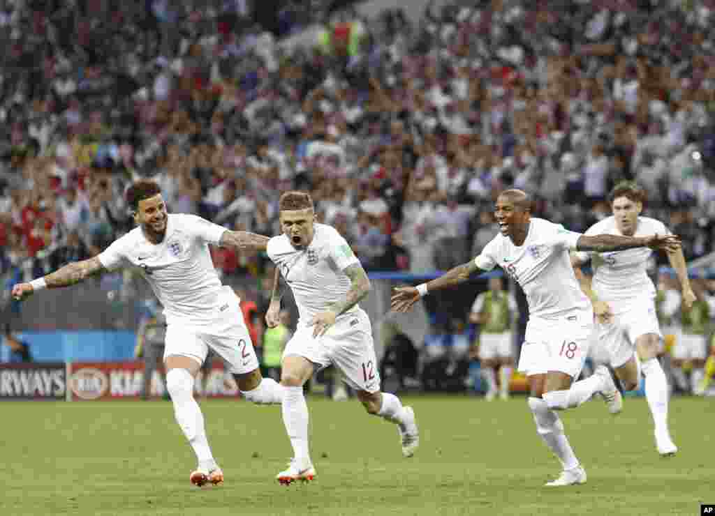 England&#39;s Kieran Trippier, second from left, celebrates after scoring the opening goal during the semifinal match between Croatia and England at the 2018 soccer World Cup in the Luzhniki Stadium in Moscow, Russia.