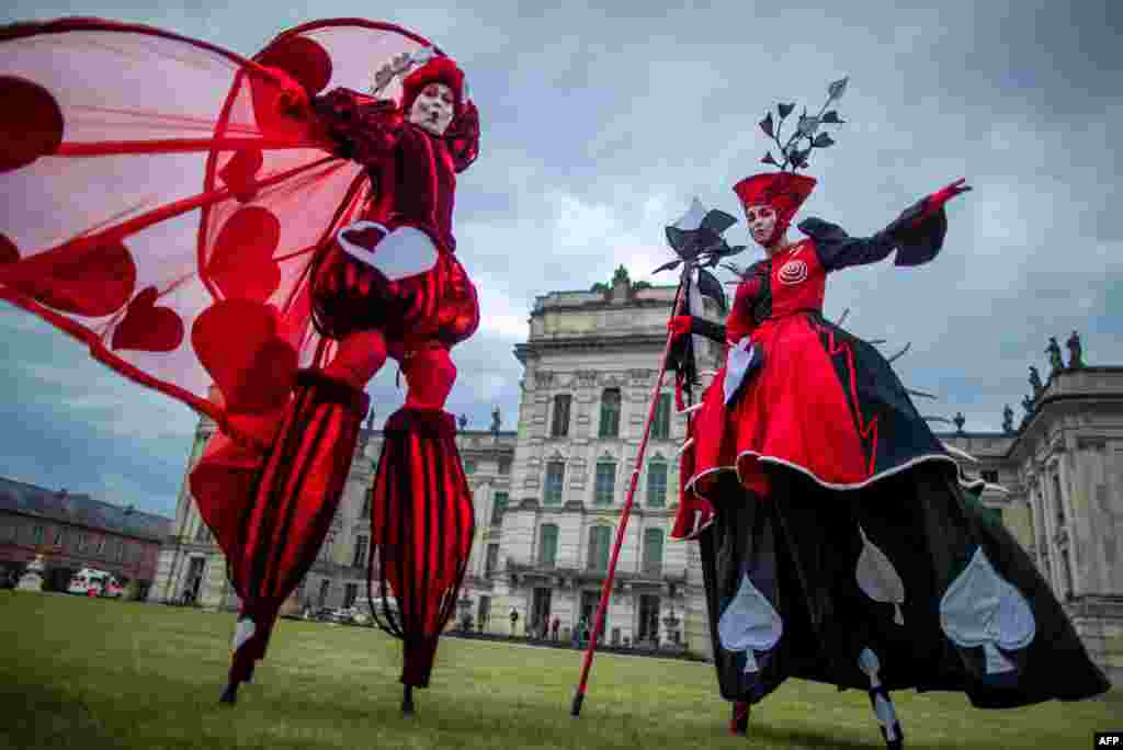 Dancers of the Art Tremendo dance company perform in front of the Ludwigslust's castle, in northern Germany on to promote the "Small Festival in a Big Park" festival this August.