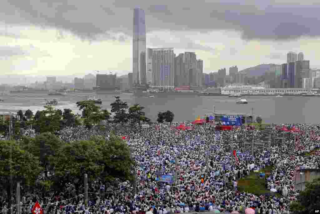 Pro-China&#39;s supporters hold Chinese flags and placards read &quot;We support police&quot; during a rally outside Legislative Council Complex in Hong Kong.