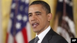 President Barack Obama speaks about the capture and killing of Osama bin Laden before he awarded the Medal of Honor posthumously to two Korean War veterans during a ceremony in the East Room of the White House, Monday, May 2, 2011